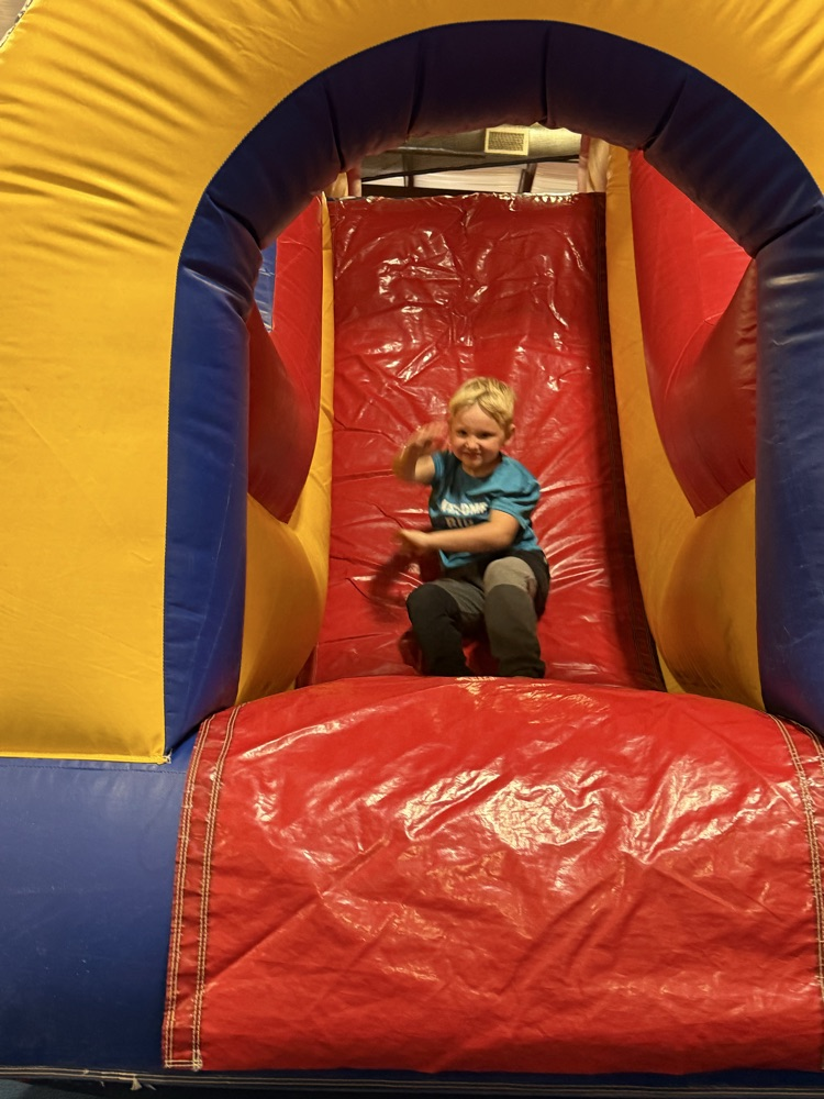 student on bounce house