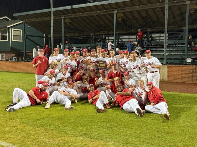 baseball team in a huddle on the field