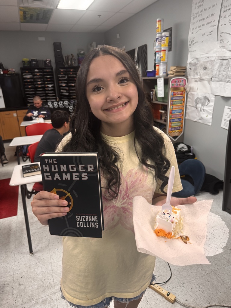 HUNGER GAMES READING AND EATING CAKE