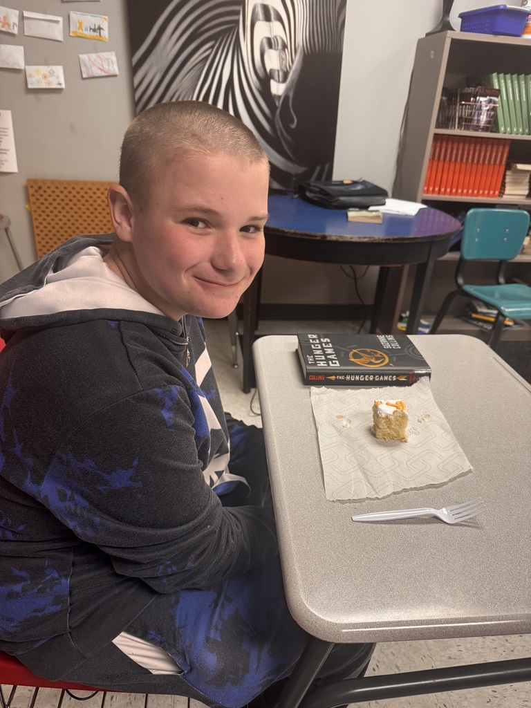 HUNGER GAMES READING AND EATING CAKE