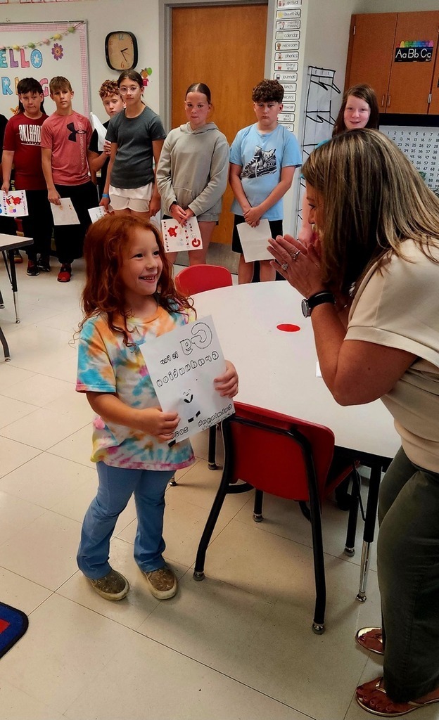 student giving a picture