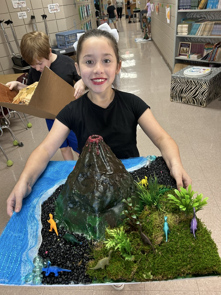 student with their volcano 