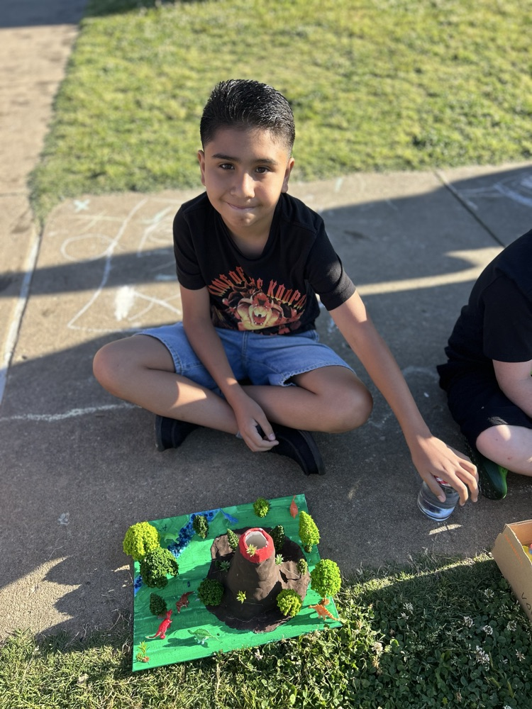 student with their volcano 