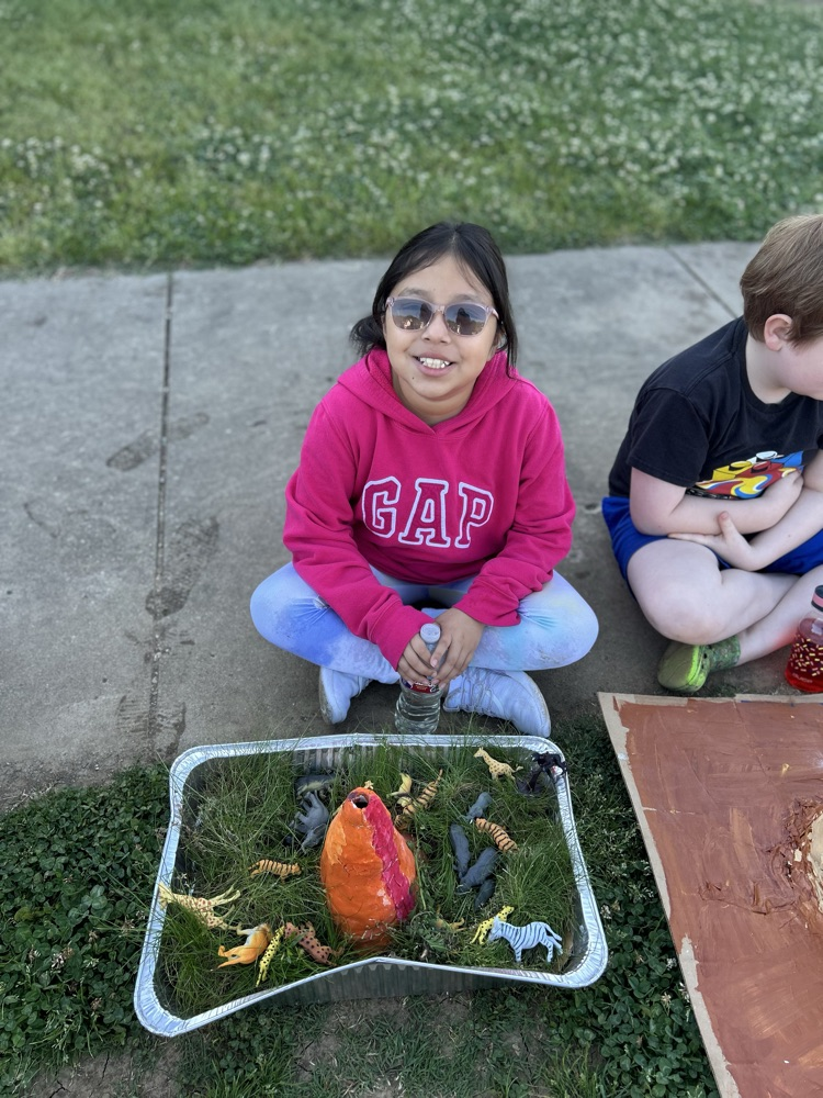 student with their volcano 