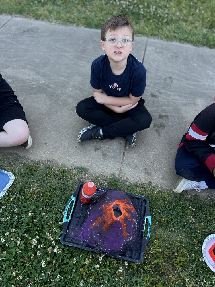 student with their volcano 