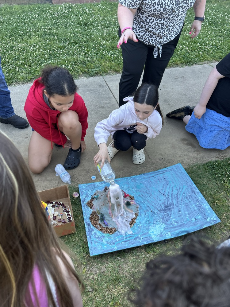 student with their volcano 