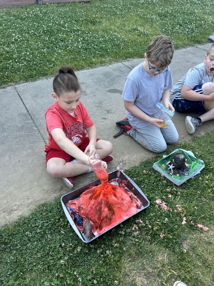 student with their volcano 