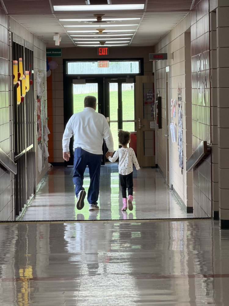 Mr Grisham taking a walk with student 