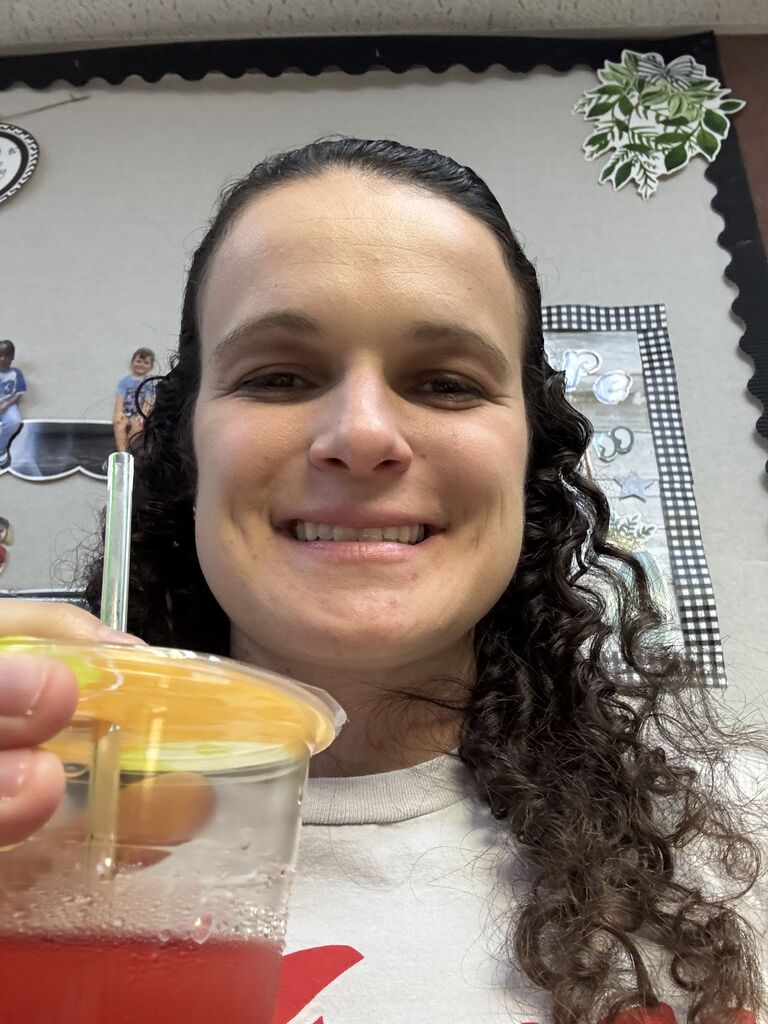 a staff member holding a tea