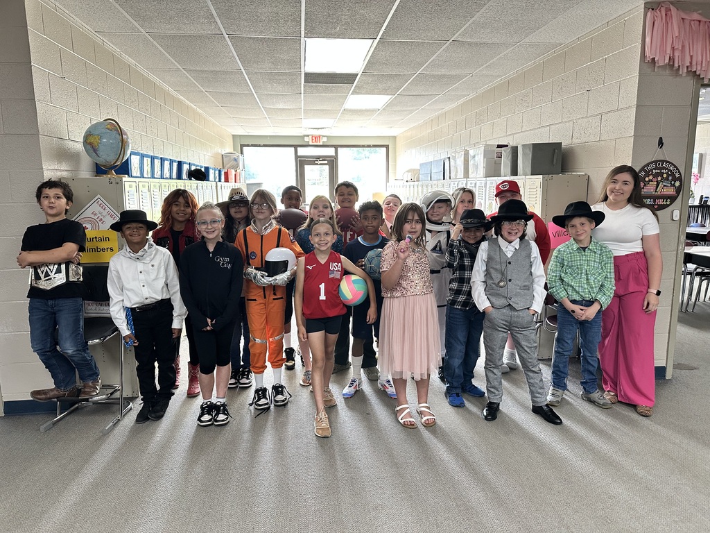 student smiling as group before the wax museum