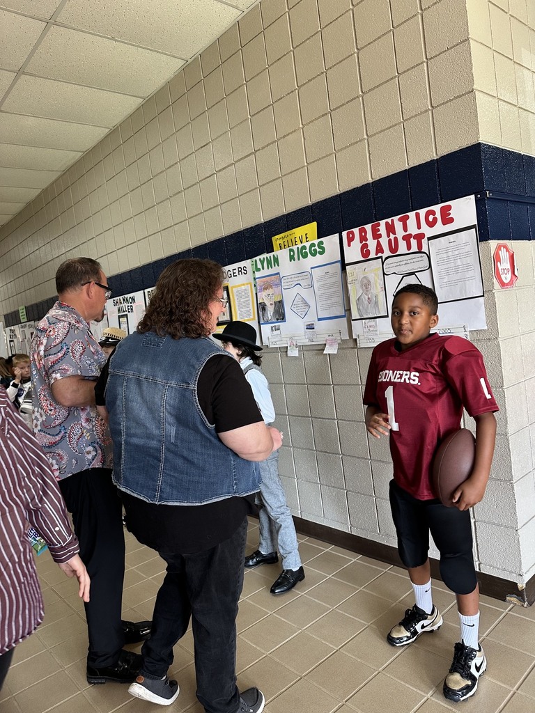 Students presenting for the wax museum