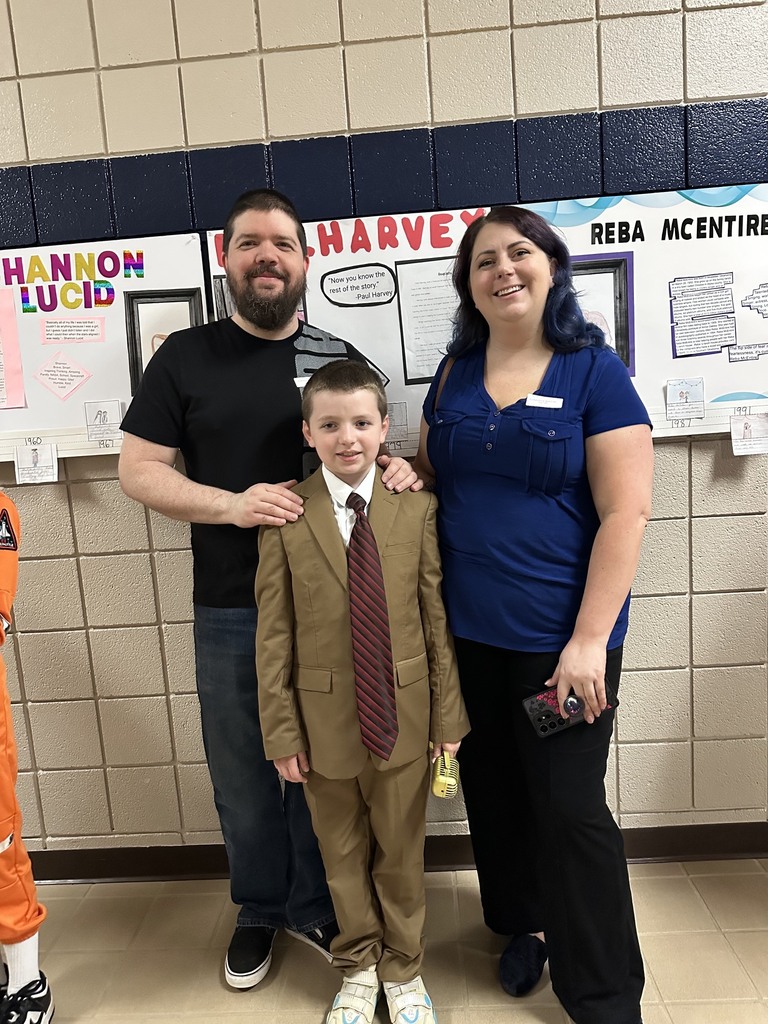 Student at the wax museum with parents