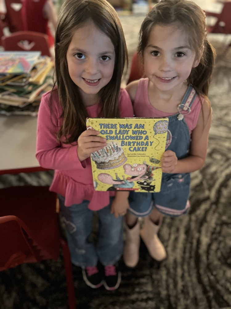  photo of students with a book 