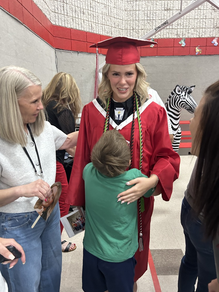 student hugging senior 