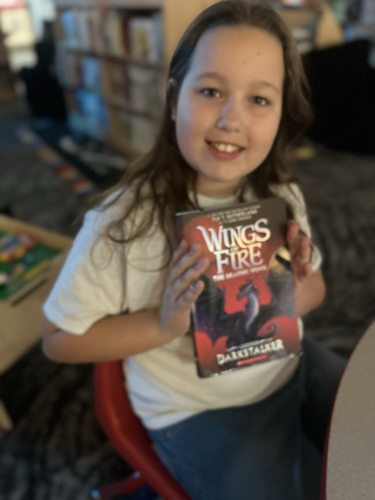 student with book 