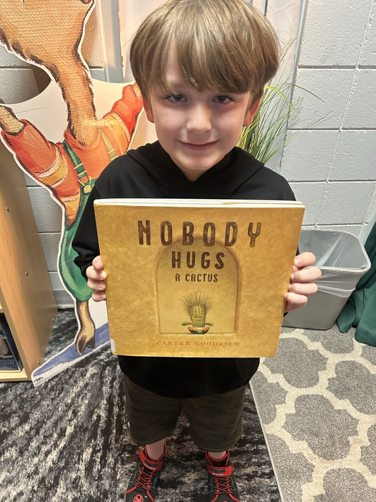 student with cactus book 