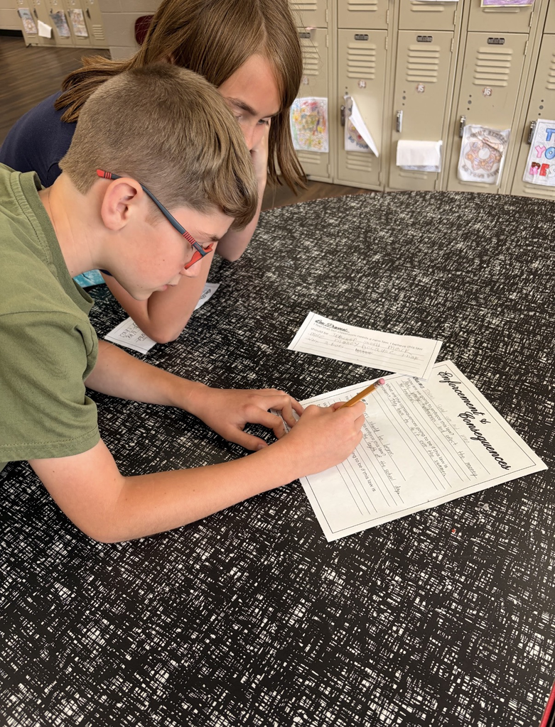 students writing things down