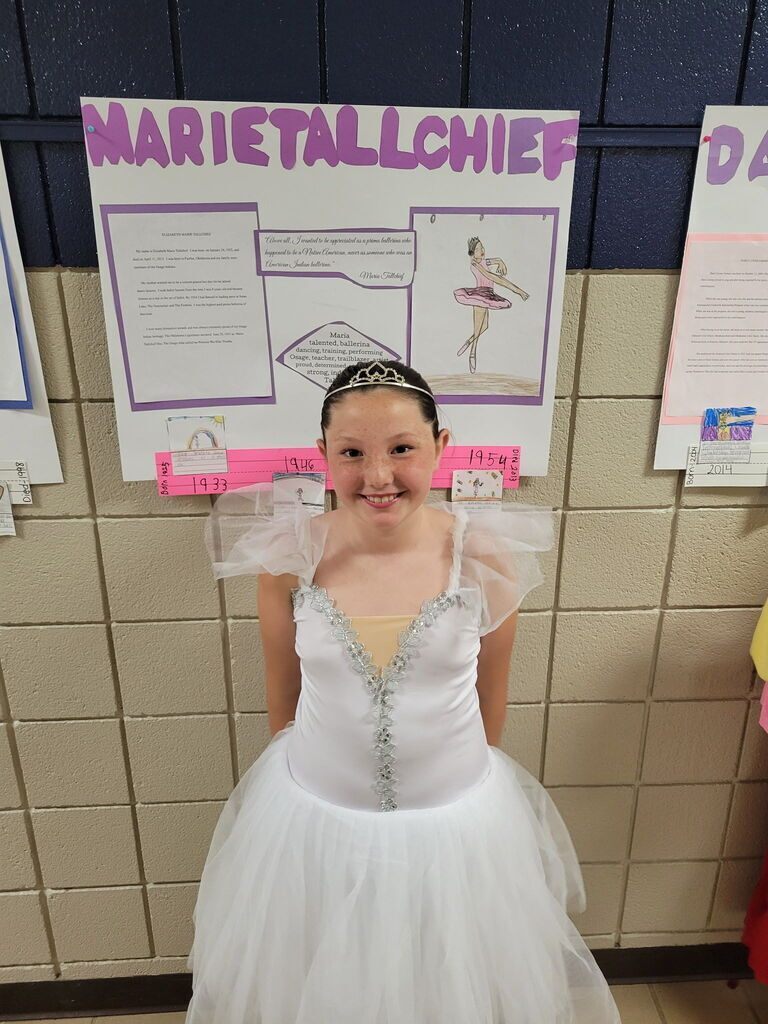 Elementary student dressed as historical figures of Oklahoma.