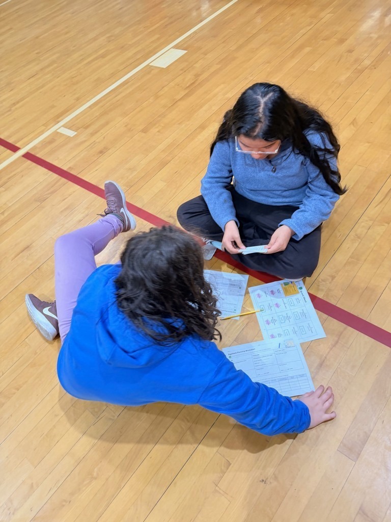 Junior high students learning about budgeting