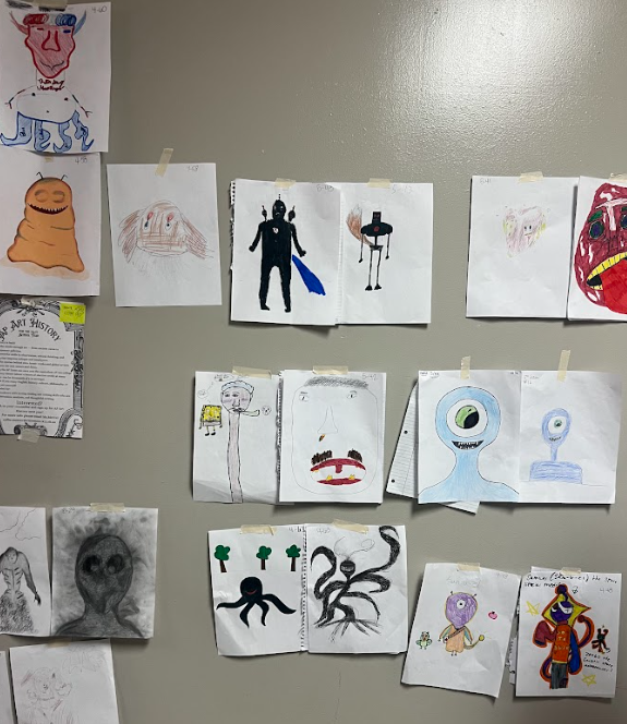 🎨👾 Creativity came to life in English I through our "Monster Projects!"  Students designed original monsters while practicing descriptive and reflective writing skills. Using imagery, simile, and metaphor, they crafted detailed descriptions of their creations. Those descriptions were then exchanged with classmates, who recreated the monsters based only on the writing provided.  The project wrapped up with students comparing the original designs to the recreations and reflecting on how effective descriptive writing can bring ideas to life. Great work by our English I students!
