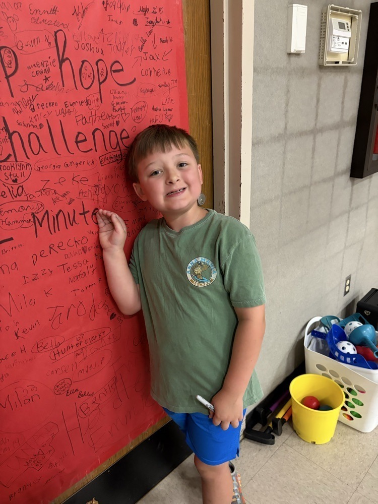 Westside elementary student signing jump rope poster