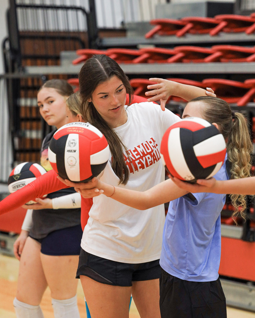 Volleyball Campers working on drills and learning new skills.
