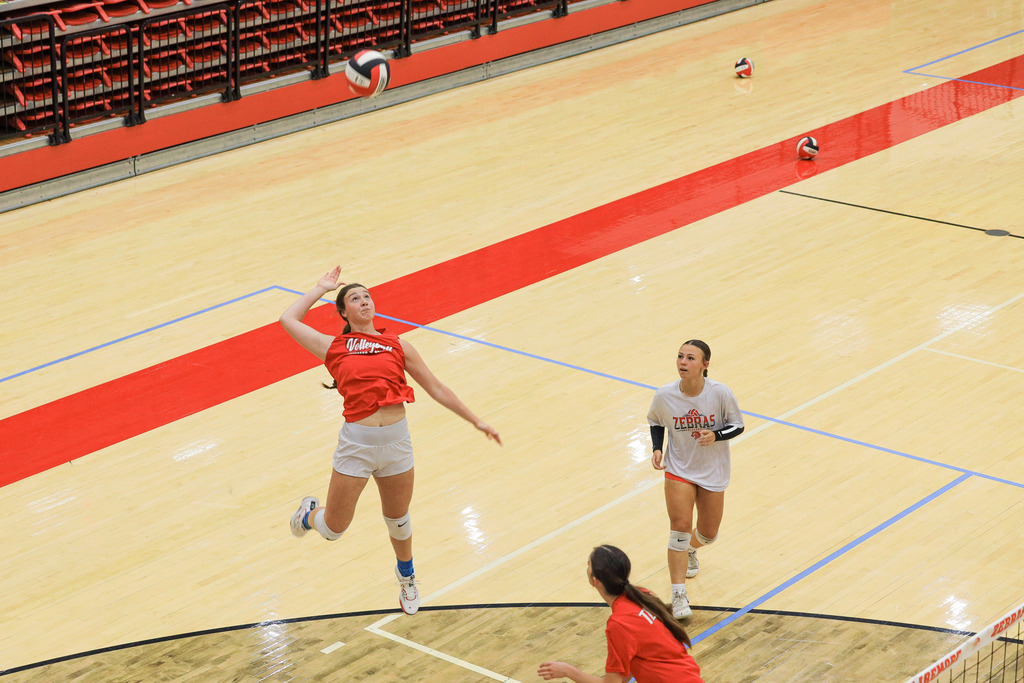 Volleyball Campers working on drills and learning new skills.