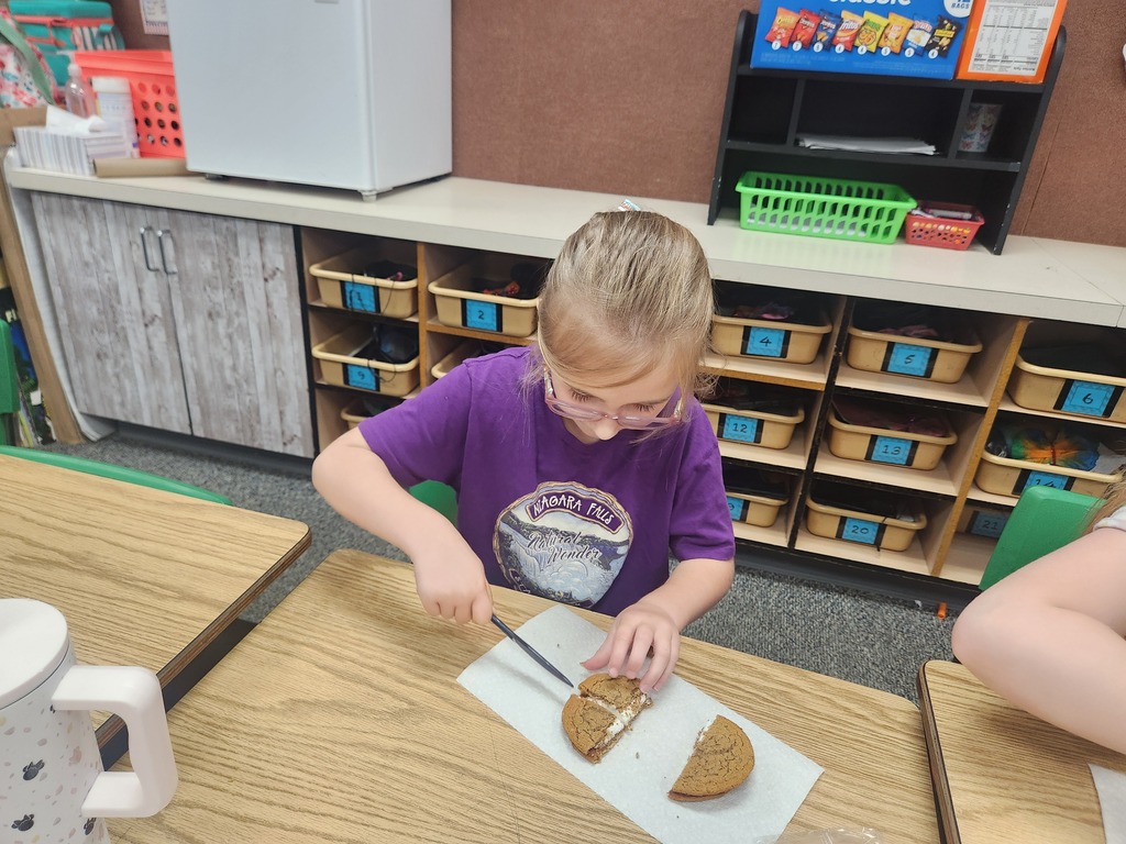 students practicing their fractions with oatmeal cream pies, they're cutting them and eating them too