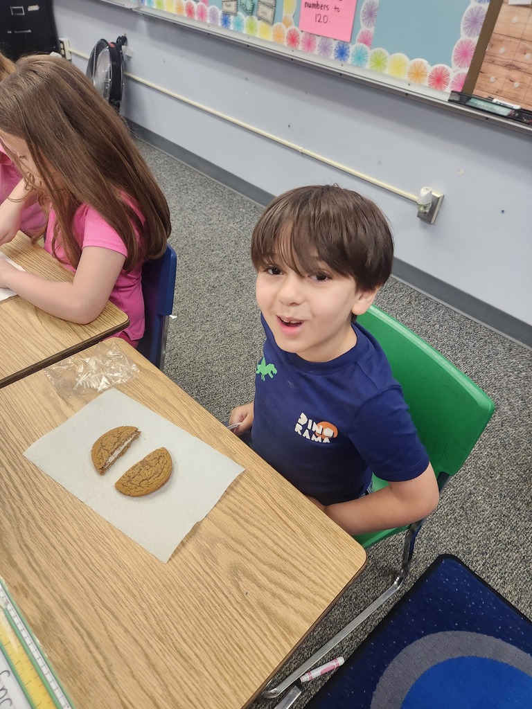 students practicing their fractions with oatmeal cream pies, they're cutting them and eating them too
