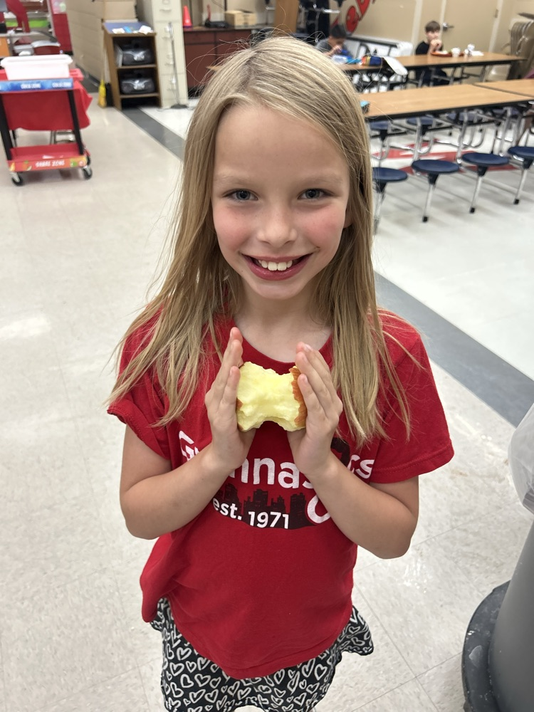 student eating apple 
