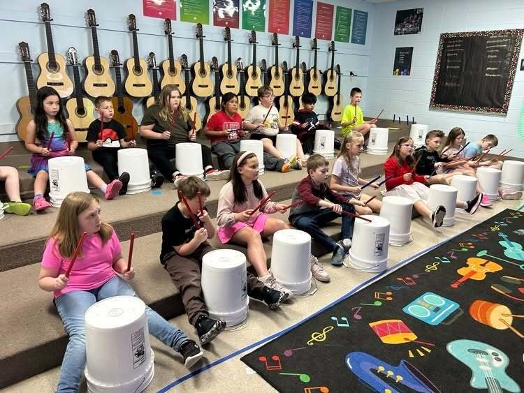 students learning the drums