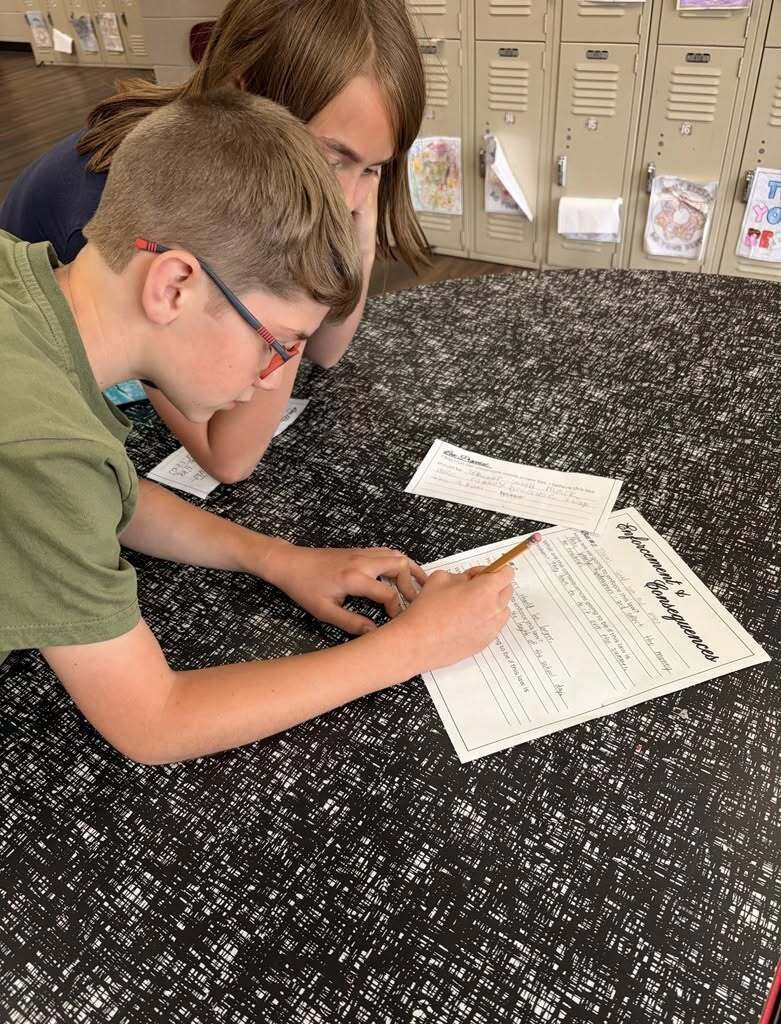 students working on a lesson on government