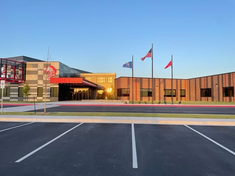 Flag poles in front of school