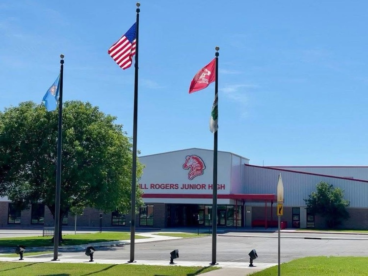 Flag poles in front of school