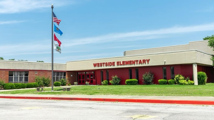 Flag poles in front of school