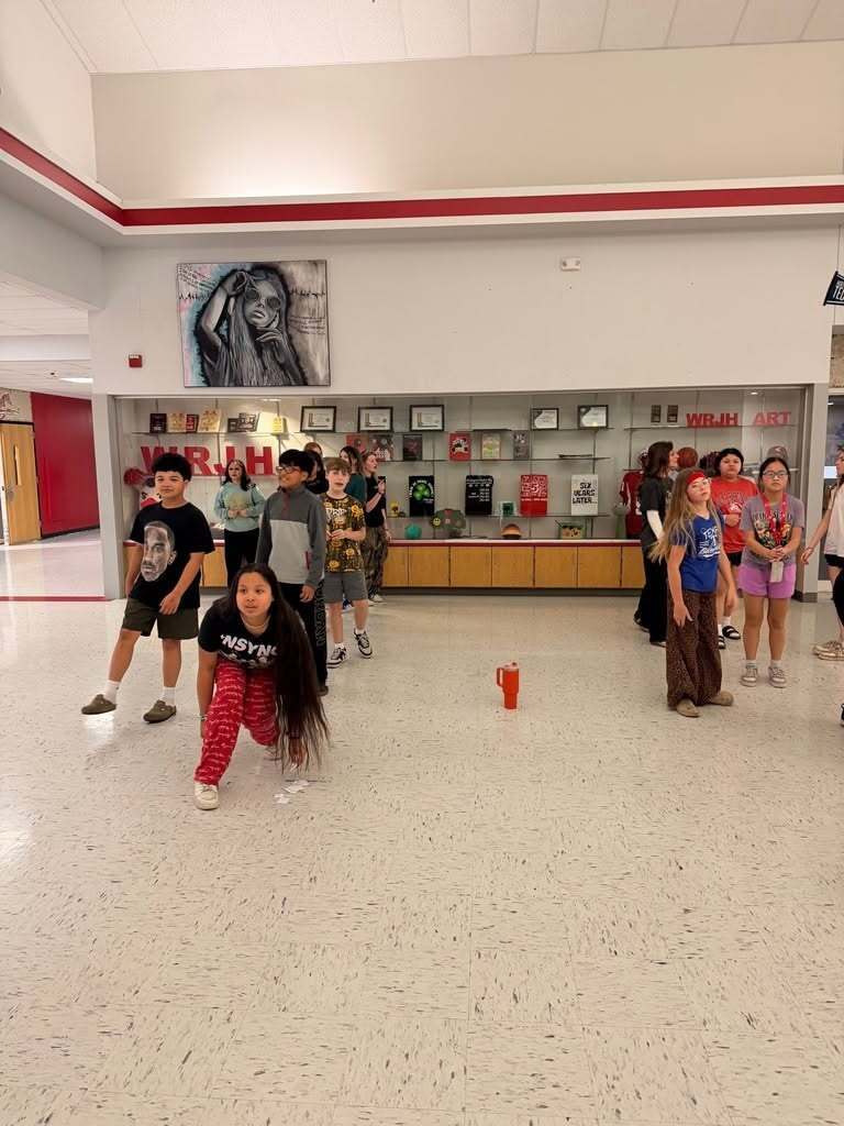 Junior high students having class in the hall