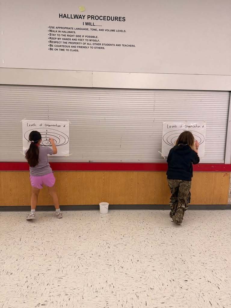 Junior high students having class in the hall