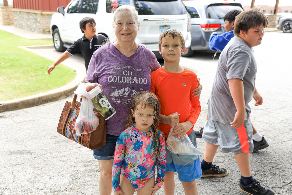 Claremore community members with their free meal at the splash pad
