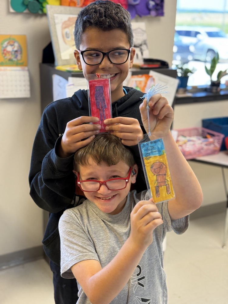 students with their new bookmarks for the summer.