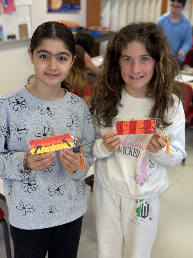 Students holding their finished bookmarks