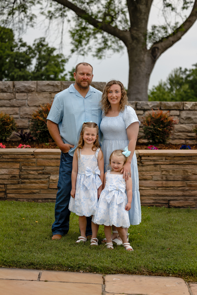 new teacher with spouse and two daughters
