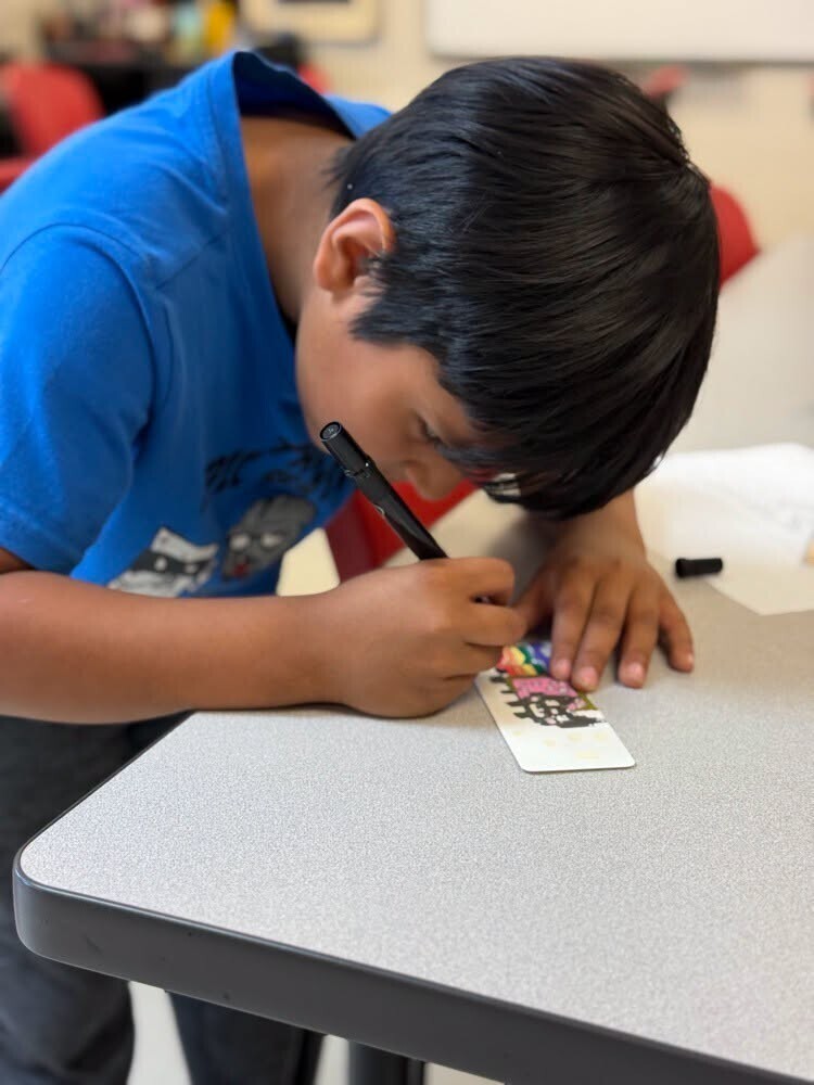 Students working on bookmarks.