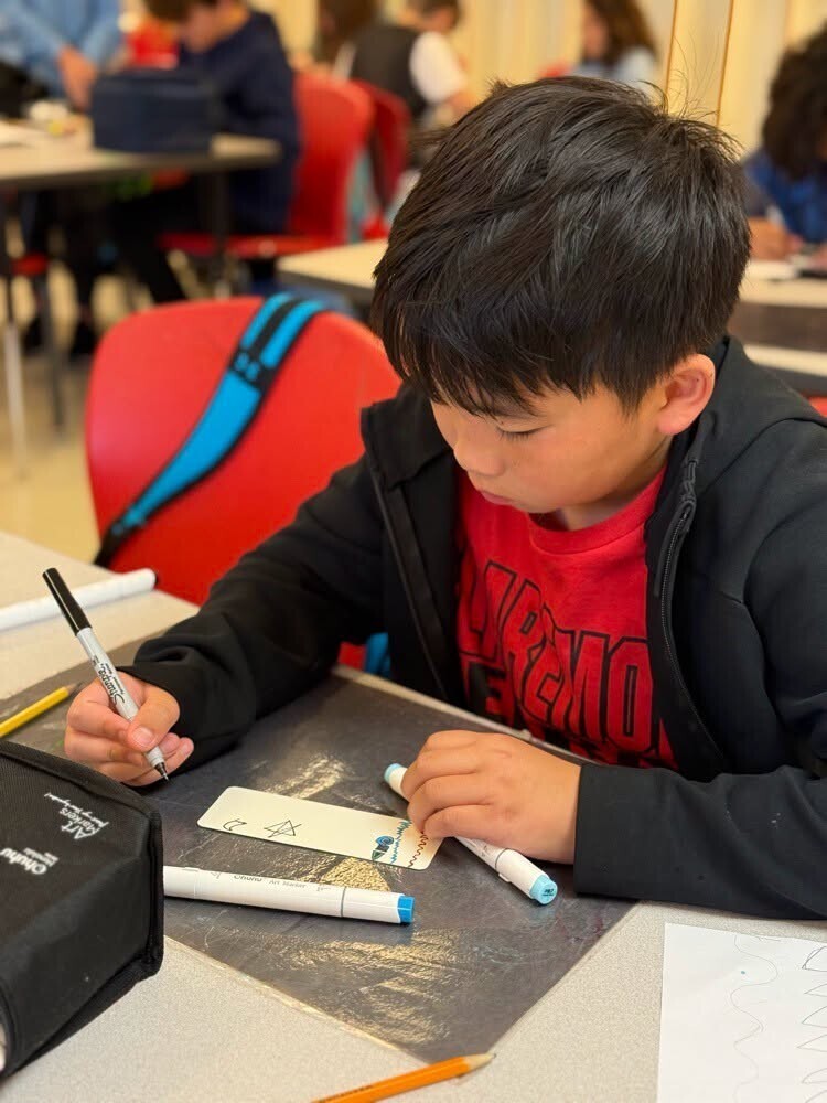 Students working on bookmarks.