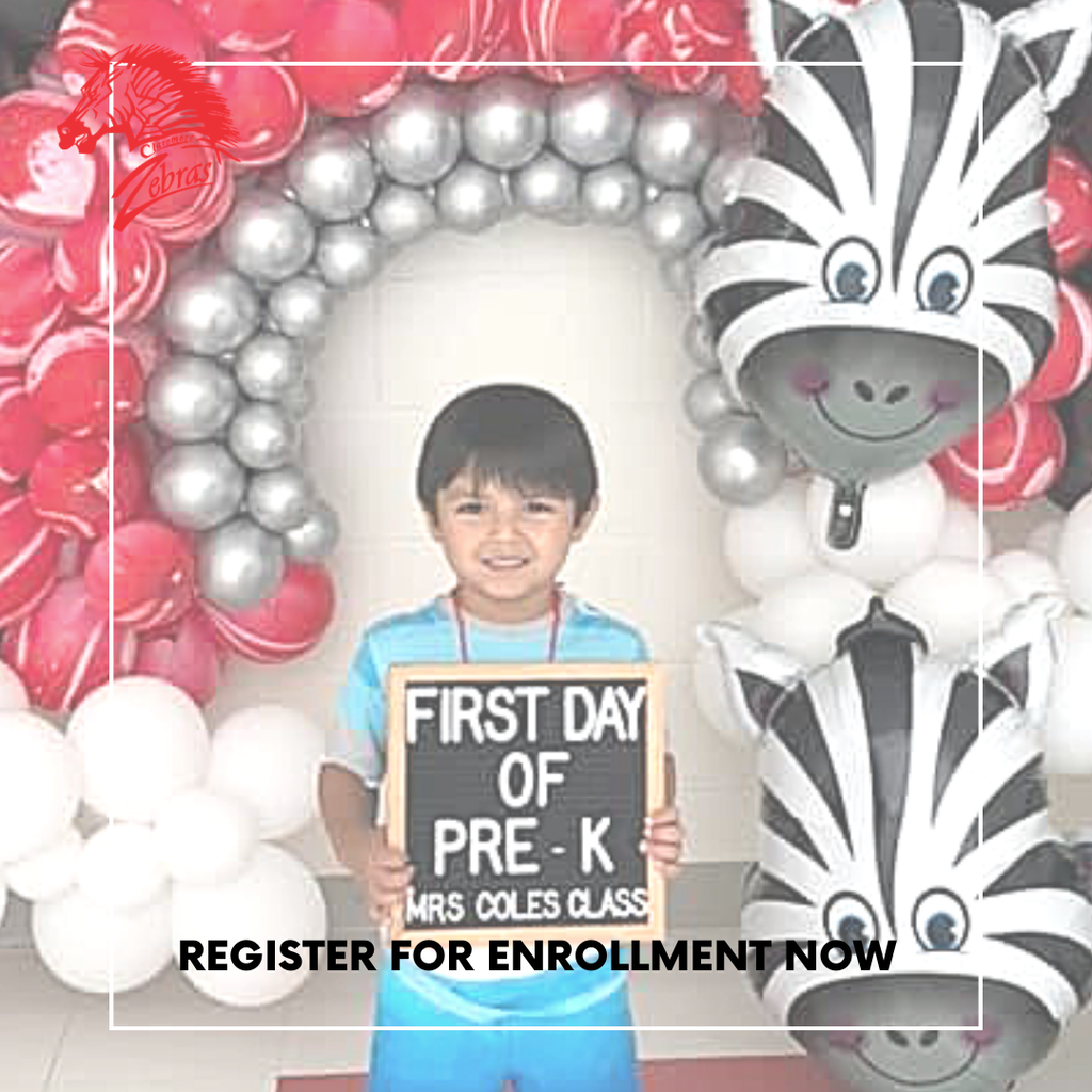 student standing in front of a ballon arch with a first day of school sign
