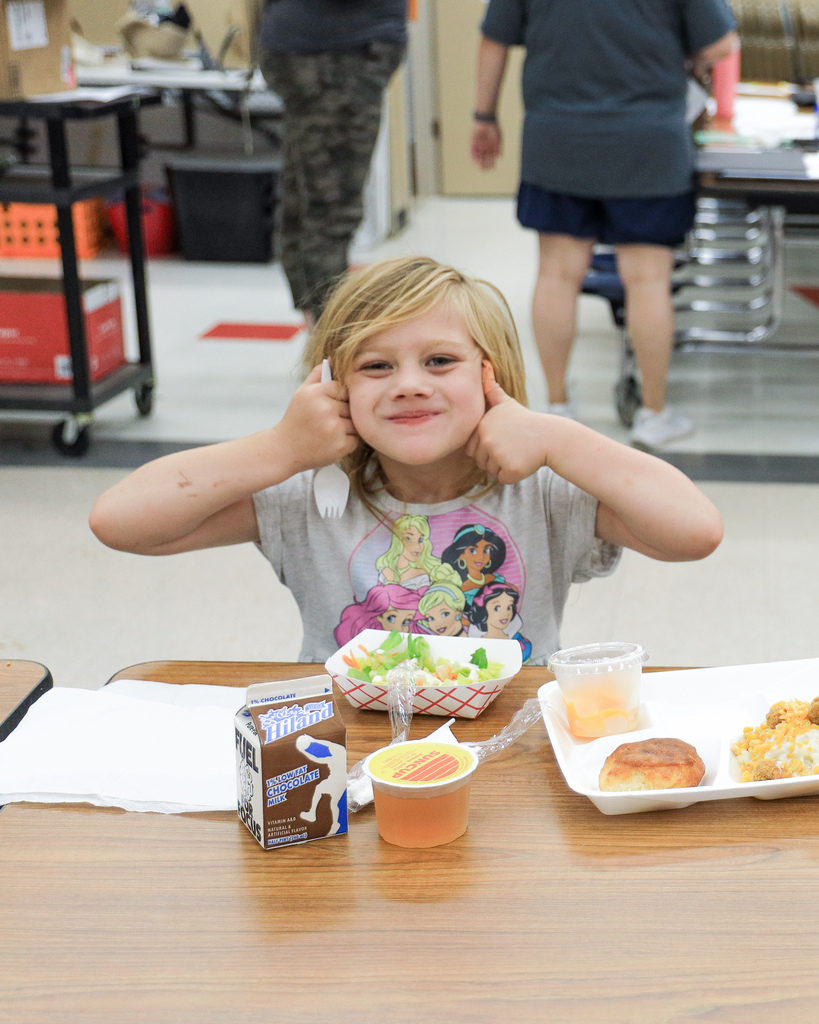 Kid enjoying a free meal at westside.