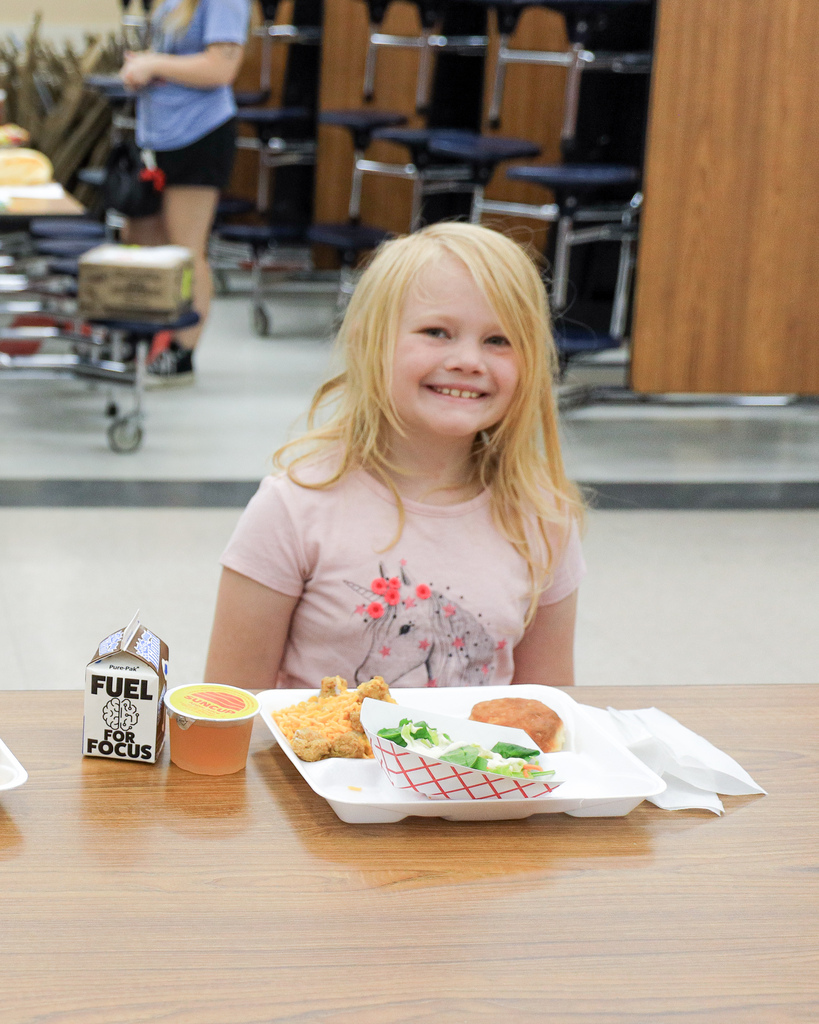 Kid enjoying a free meal at westside.