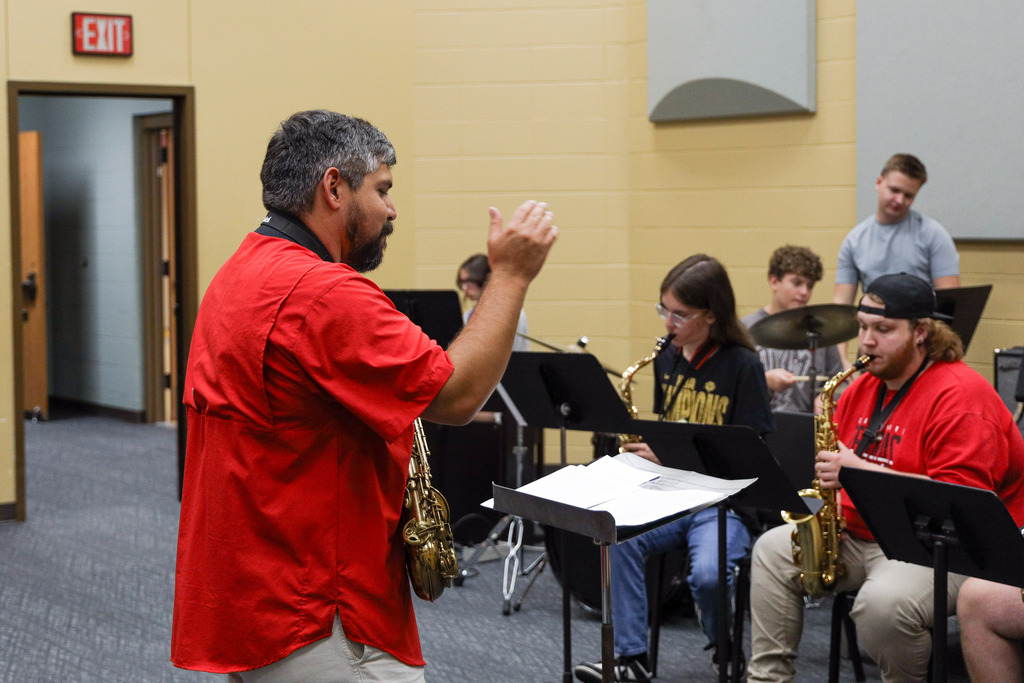 Instructor conducting as students play.