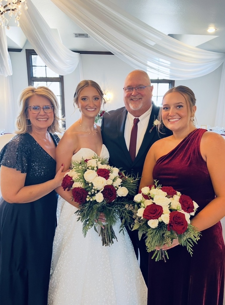 Jill with her family holding flowers