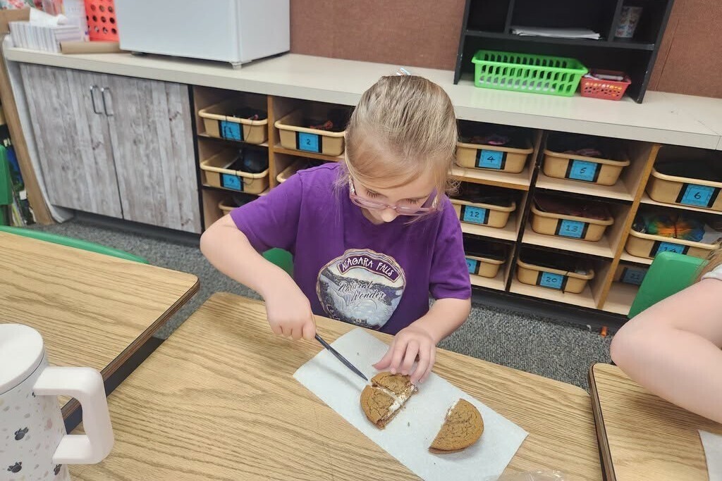 Elementary students learning about fractions with pies.