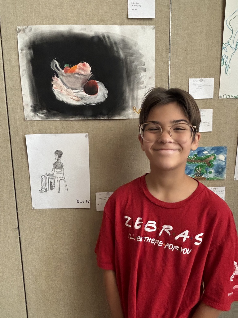 Rori Williams at the Philbrook with his art work.